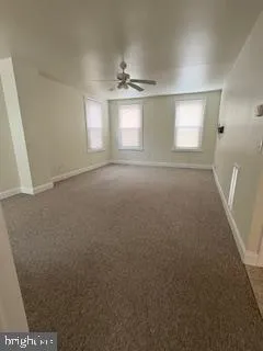 a view of empty room with windows