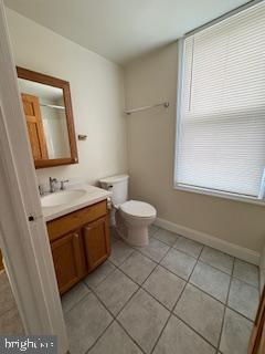 220 Ryers Avenue Cheltenham, PA 19012 - Photo 10 of 19 a bathroom with a sink a toilet and mirror