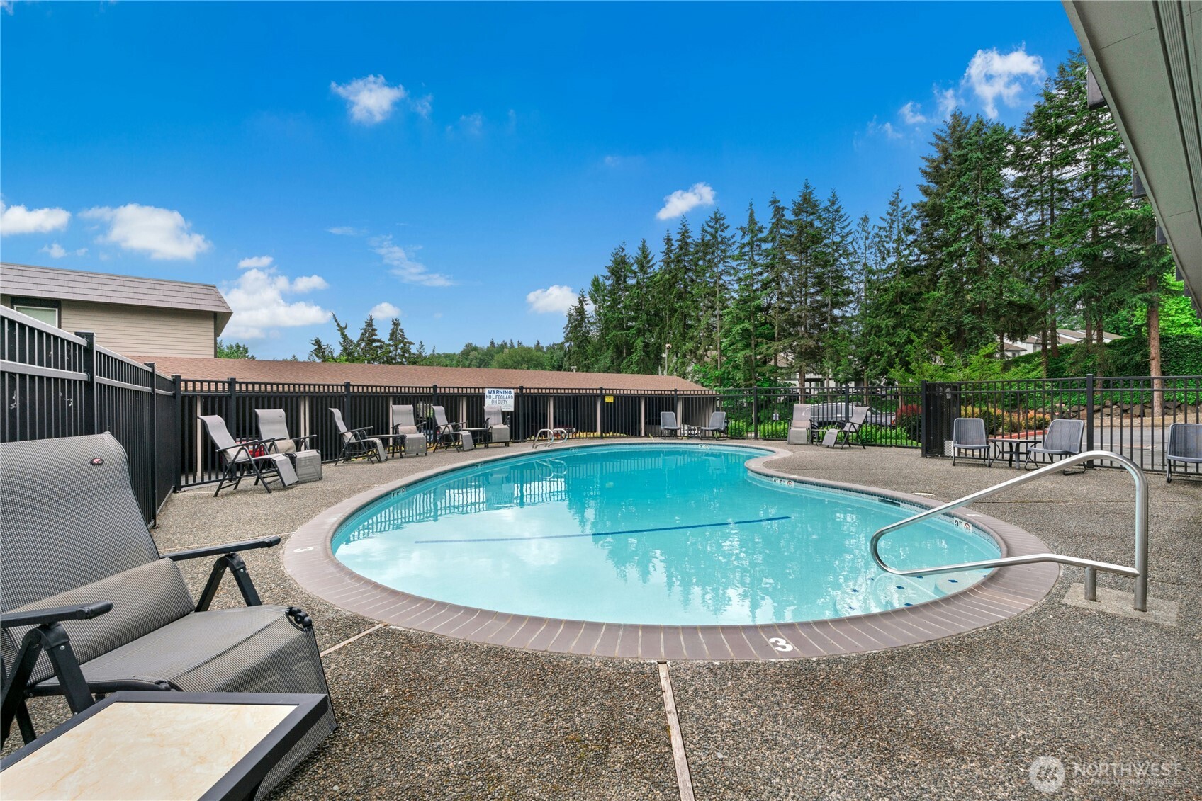 9523 Northeast 180th Street, Unit A102 Bothell, WA 98011 - Photo 25 of 29 a view of a swimming pool with a patio
