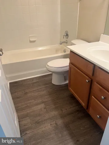 a bathroom with a sink toilet and bathtub