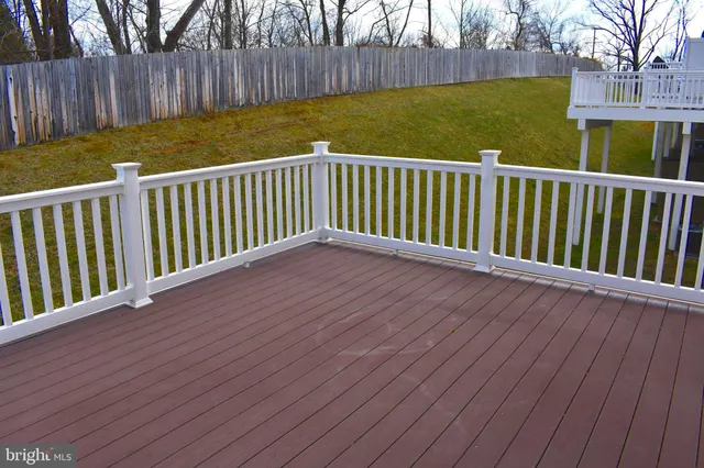 a view of a backyard with a wooden fence
