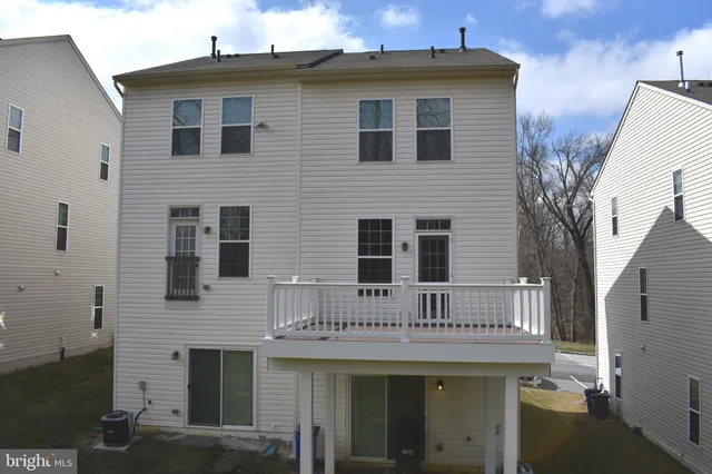 a front view of a house with a wooden fence