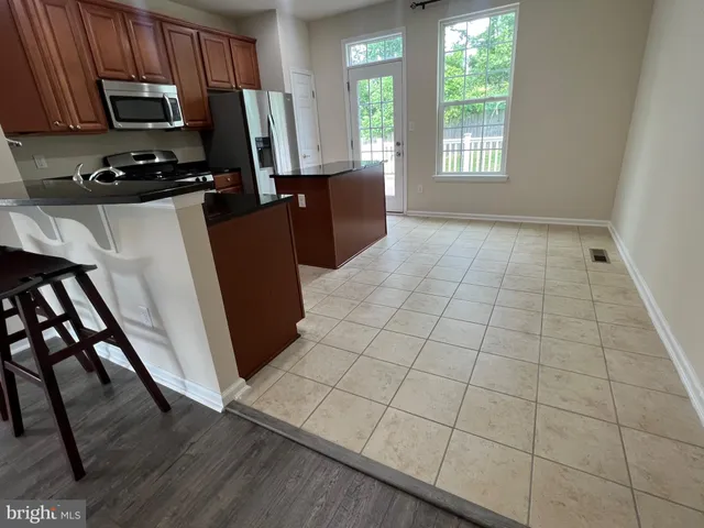 a kitchen with sink cabinets and window