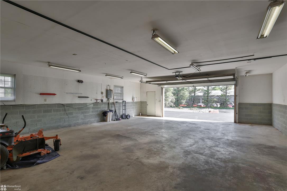 205 West Moorestown Road Wind Gap, PA 18091 - Photo 16 of 20 A spacious and practical garage provides ample storage and workshop space with easy outdoor access.