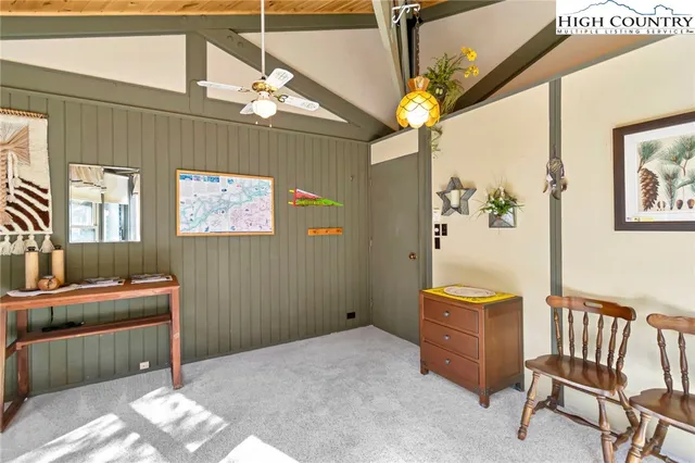 a bedroom with furniture and a window