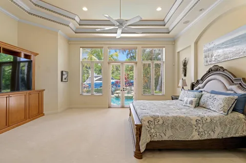 a bedroom with a large bed and a couch