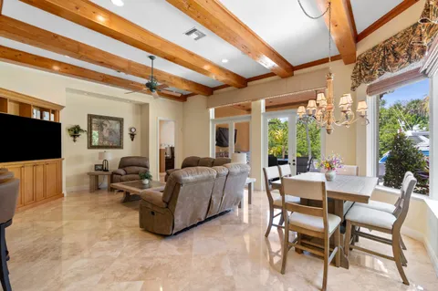 a kitchen with a stove a sink dishwasher and cabinets with wooden floor