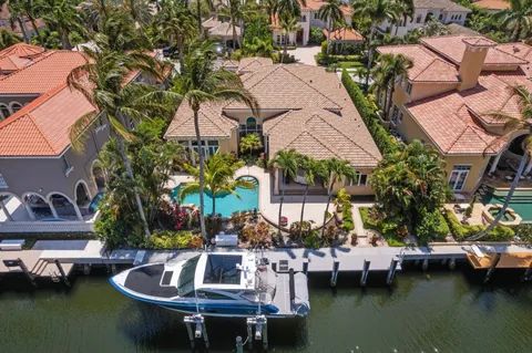 an aerial view of houses with outdoor space