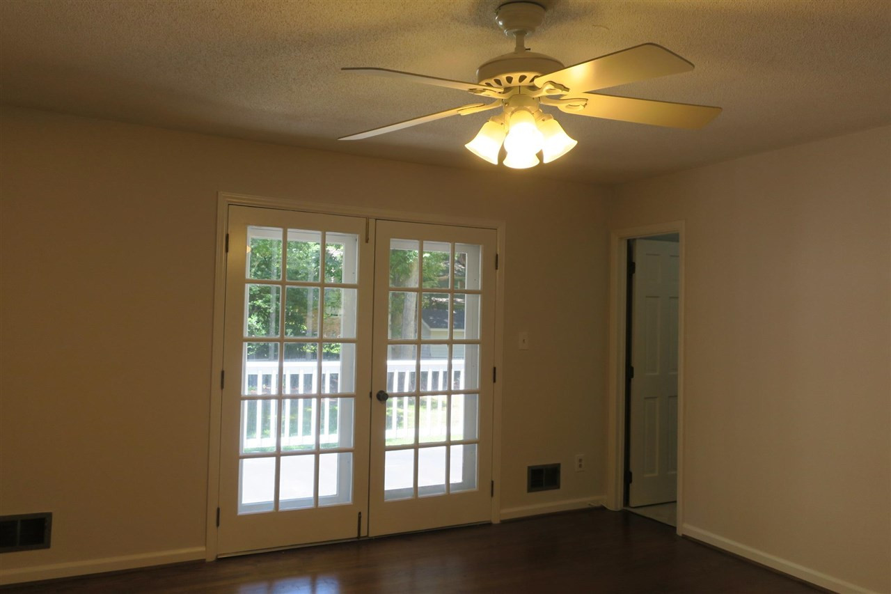 7509 Gala Court Raleigh, NC 27615 - Photo 13 of 18 Master Bedroom with double doors opening to upper deck