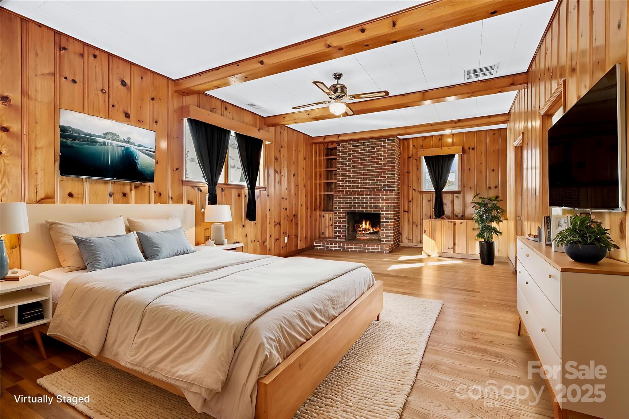 193 Dogwood Road Candler, NC 28715 - Photo 11 of 31 a spacious bedroom with a large bed a flat tv screen and a balcony view