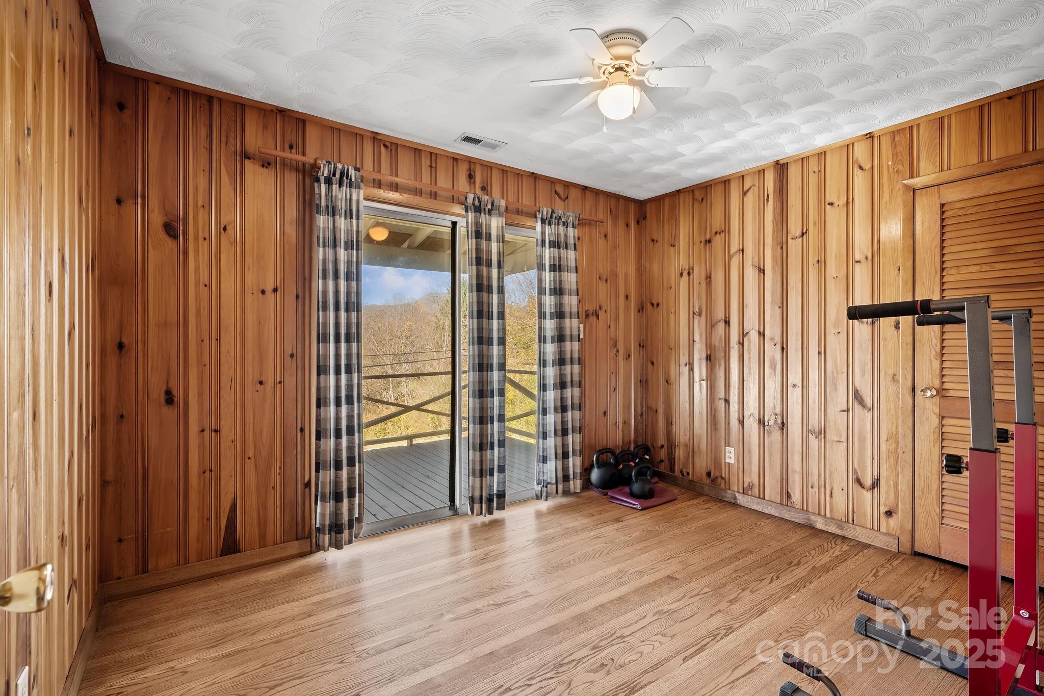 193 Dogwood Road Candler, NC 28715 - Photo 18 of 31 wooden floor and windows in a room