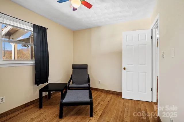 a view of a livingroom with furniture and wooden floor