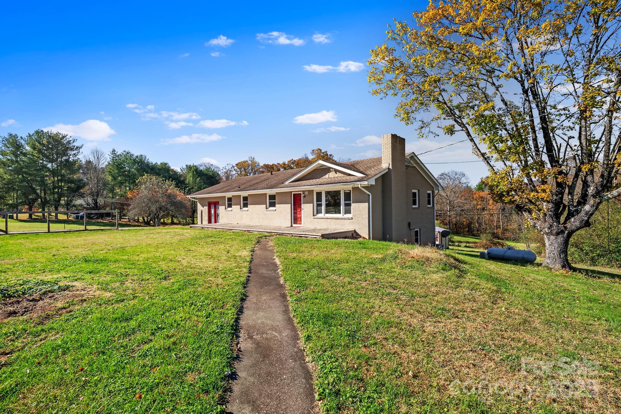 193 Dogwood Road Candler, NC 28715 - Photo 29 of 31 a front view of house with yard and green space
