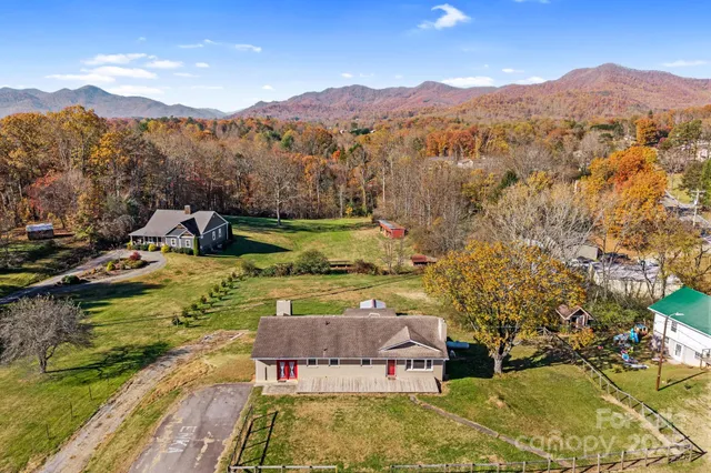 a view of a backyard with a lake view
