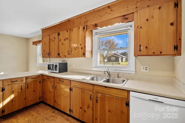 a kitchen with a sink and cabinets