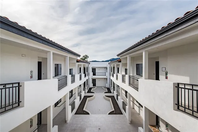 a view of a house with wooden stairs
