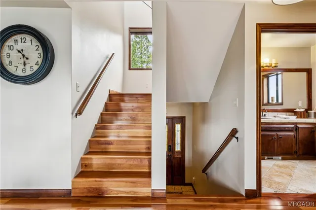 an outdoor living room with furniture and a fireplace