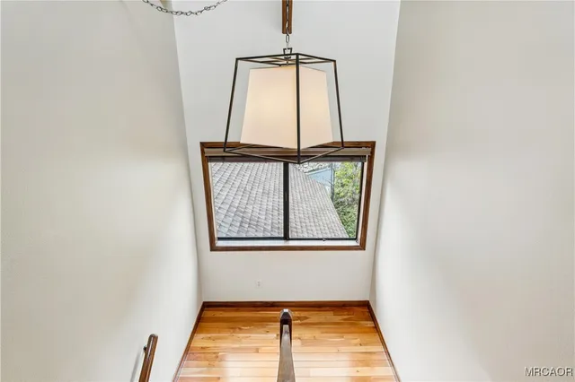 a bedroom with a bed a couch and dresser