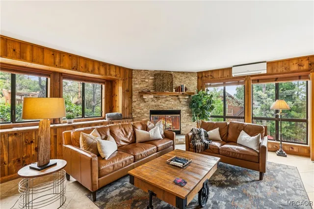 a view of a hallway with furniture and entryway