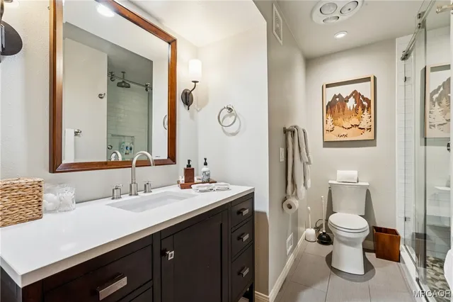 a bedroom with a bed and a table