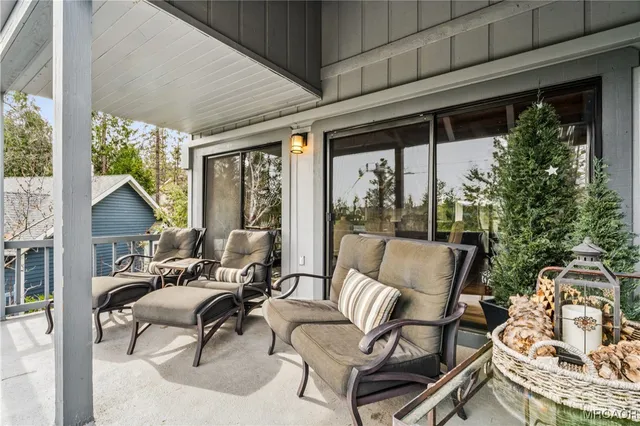 a view of a livingroom with furniture and a flat screen tv