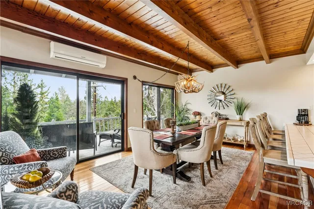a dining room with stainless steel appliances kitchen island granite countertop furniture and a kitchen view