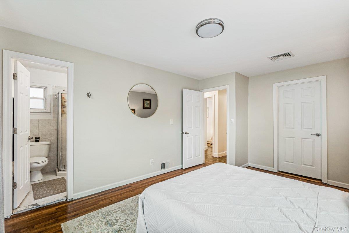 5 Terry Lane Plainview, NY 11803 - Photo 14 of 29 a bedroom with a bed and a window