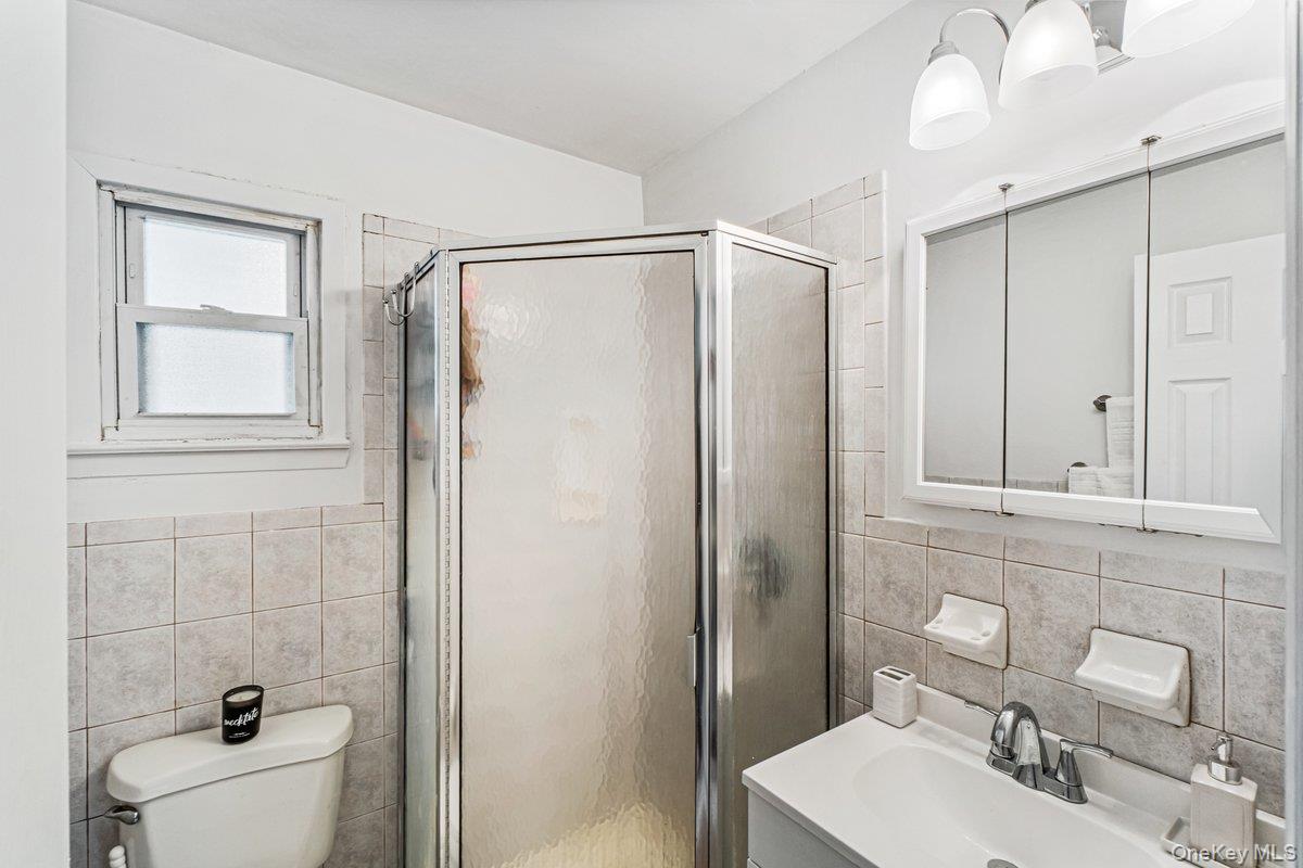 5 Terry Lane Plainview, NY 11803 - Photo 15 of 29 a bathroom with a sink toilet and shower