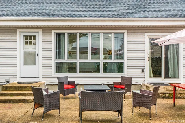 a view of a house and outdoor sitting area