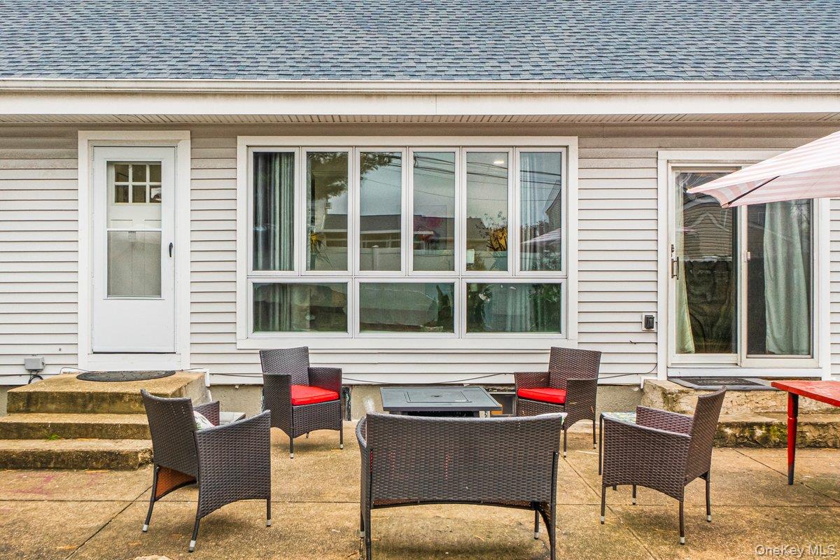 5 Terry Lane Plainview, NY 11803 - Photo 20 of 29 a view of a house and outdoor sitting area