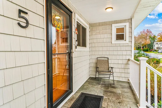 a front view of a house with large windows