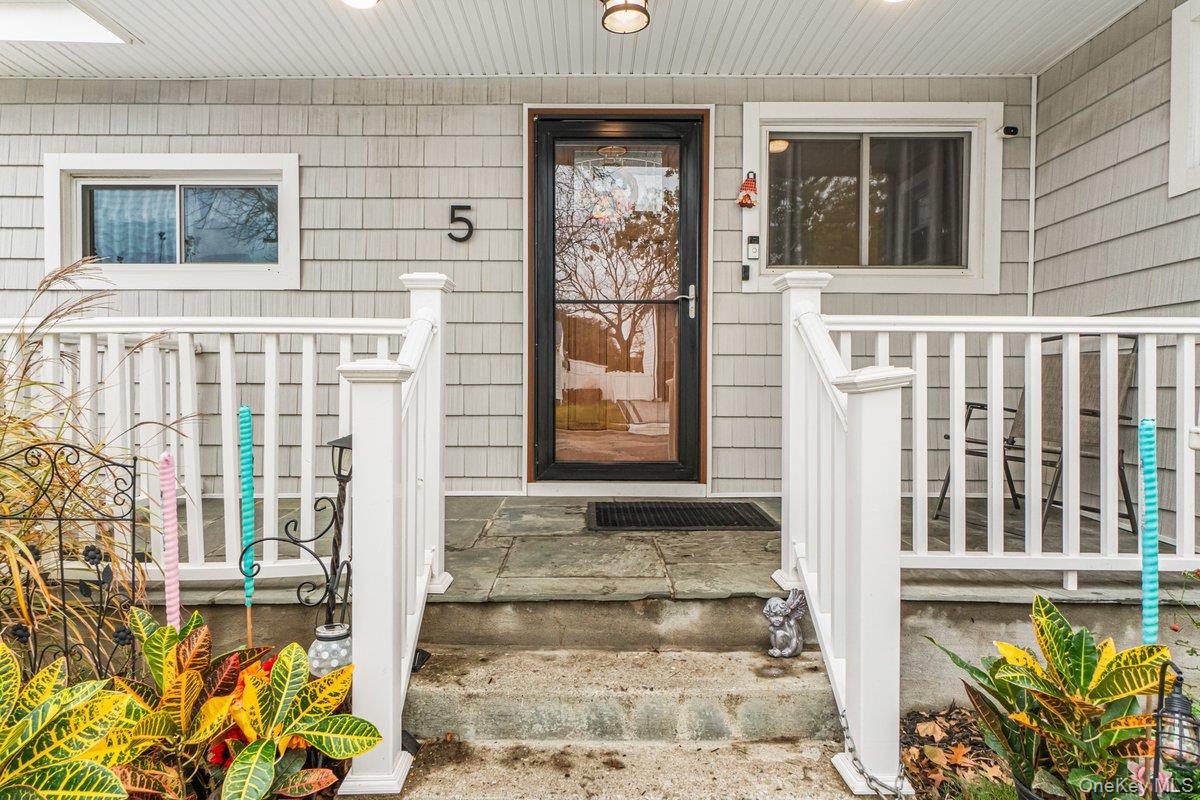 5 Terry Lane Plainview, NY 11803 - Photo 24 of 29 a front view of a house with large windows