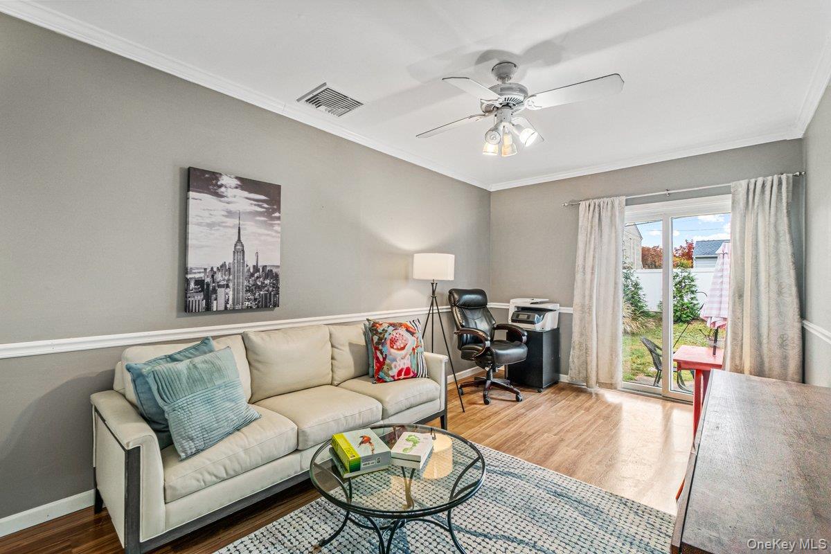 5 Terry Lane Plainview, NY 11803 - Photo 9 of 29 a living room with furniture and a wooden floor