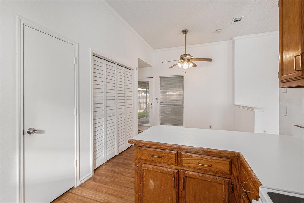 1105 Irene Drive Mesquite, TX 75149 - Photo 11 of 23 a bedroom with a bed and a chandelier