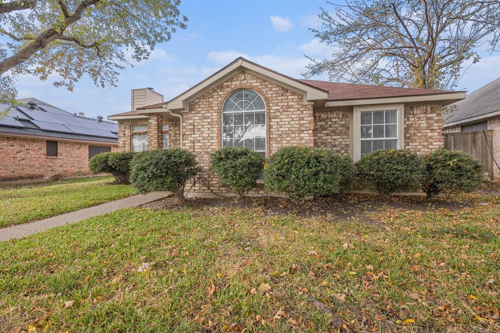 1105 Irene Drive Mesquite, TX 75149 - Photo 2 of 23 a front view of a house with garden