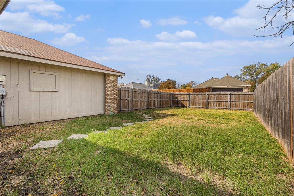 1105 Irene Drive Mesquite, TX 75149 - Photo 22 of 23 a view of a backyard with a garden