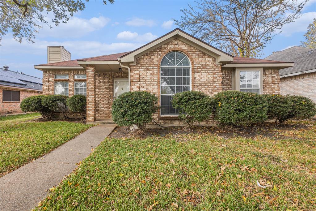 1105 Irene Drive Mesquite, TX 75149 - Photo 4 of 23 a front view of a house with garden