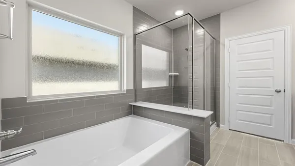 a bathroom with a bathtub and a shower