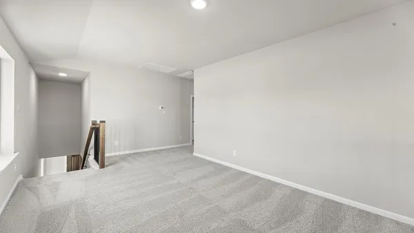 a view of a room with a wooden wall