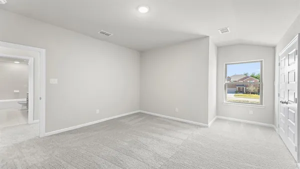a view of an empty room and a window
