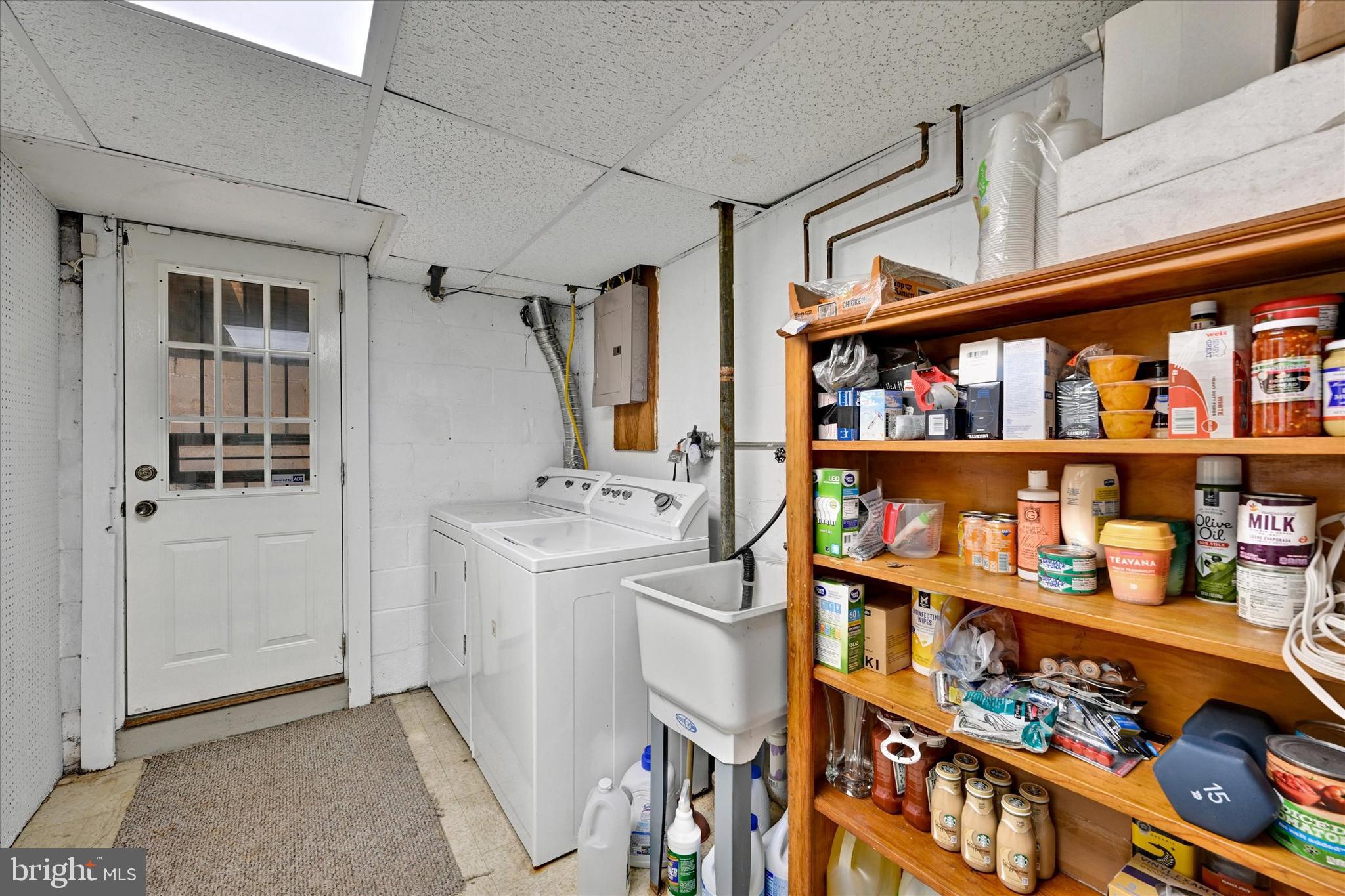 1203 Walker Avenue Baltimore, MD 21239 - Photo 20 of 31 a storage room with washer and dryer