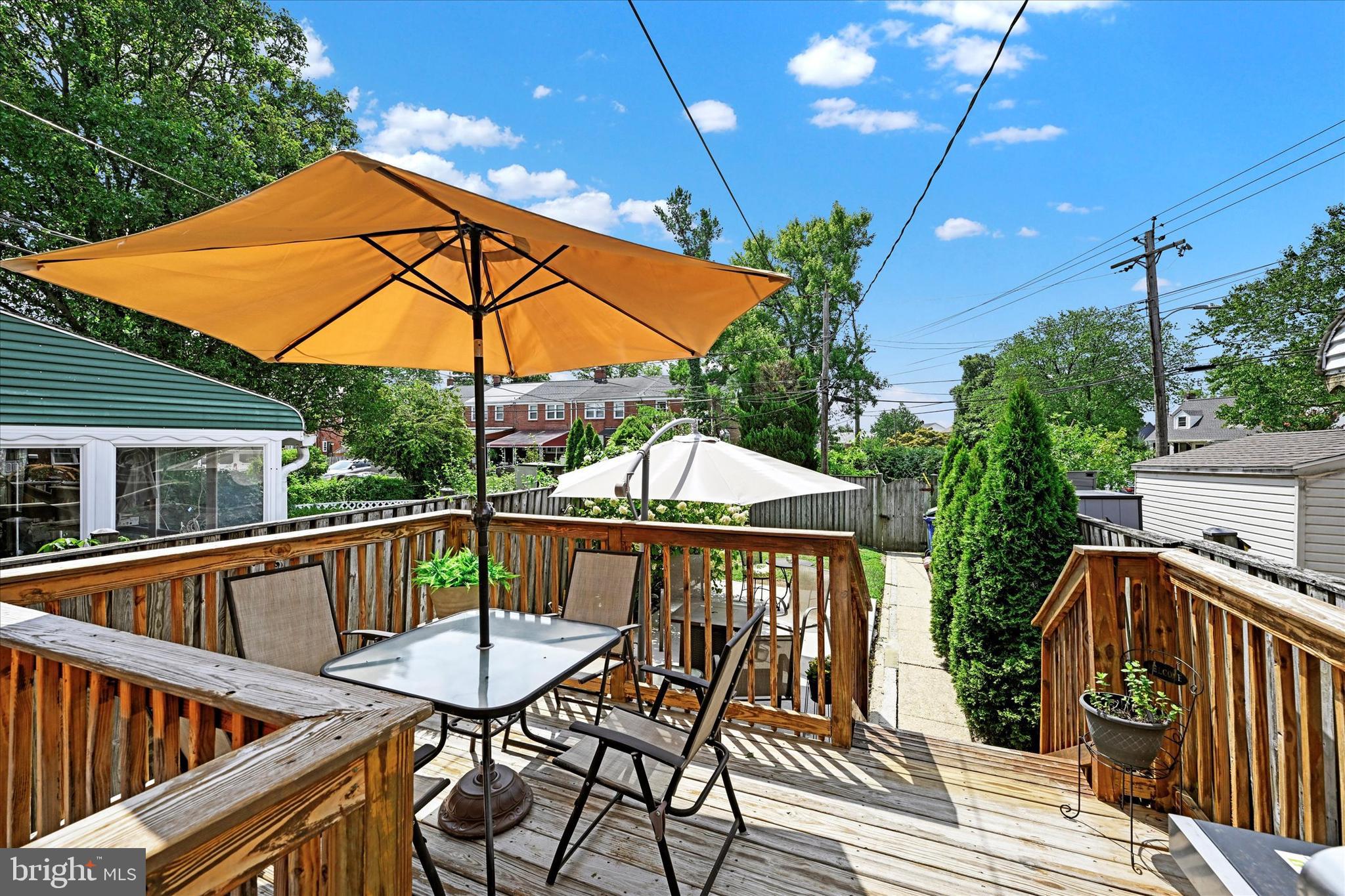 1203 Walker Avenue Baltimore, MD 21239 - Photo 24 of 31 a view of balcony with wooden floor and outdoor seating