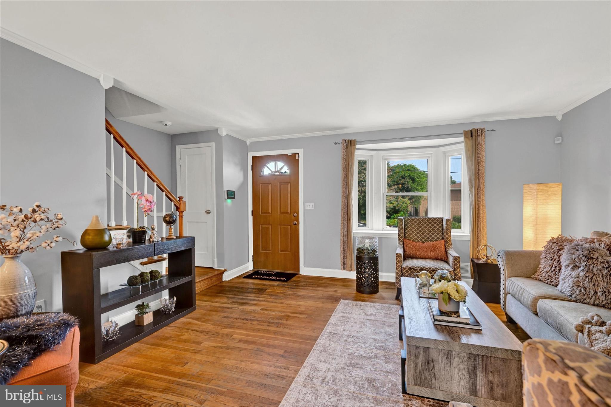 1203 Walker Avenue Baltimore, MD 21239 - Photo 3 of 31 a living room with furniture and a flat screen tv