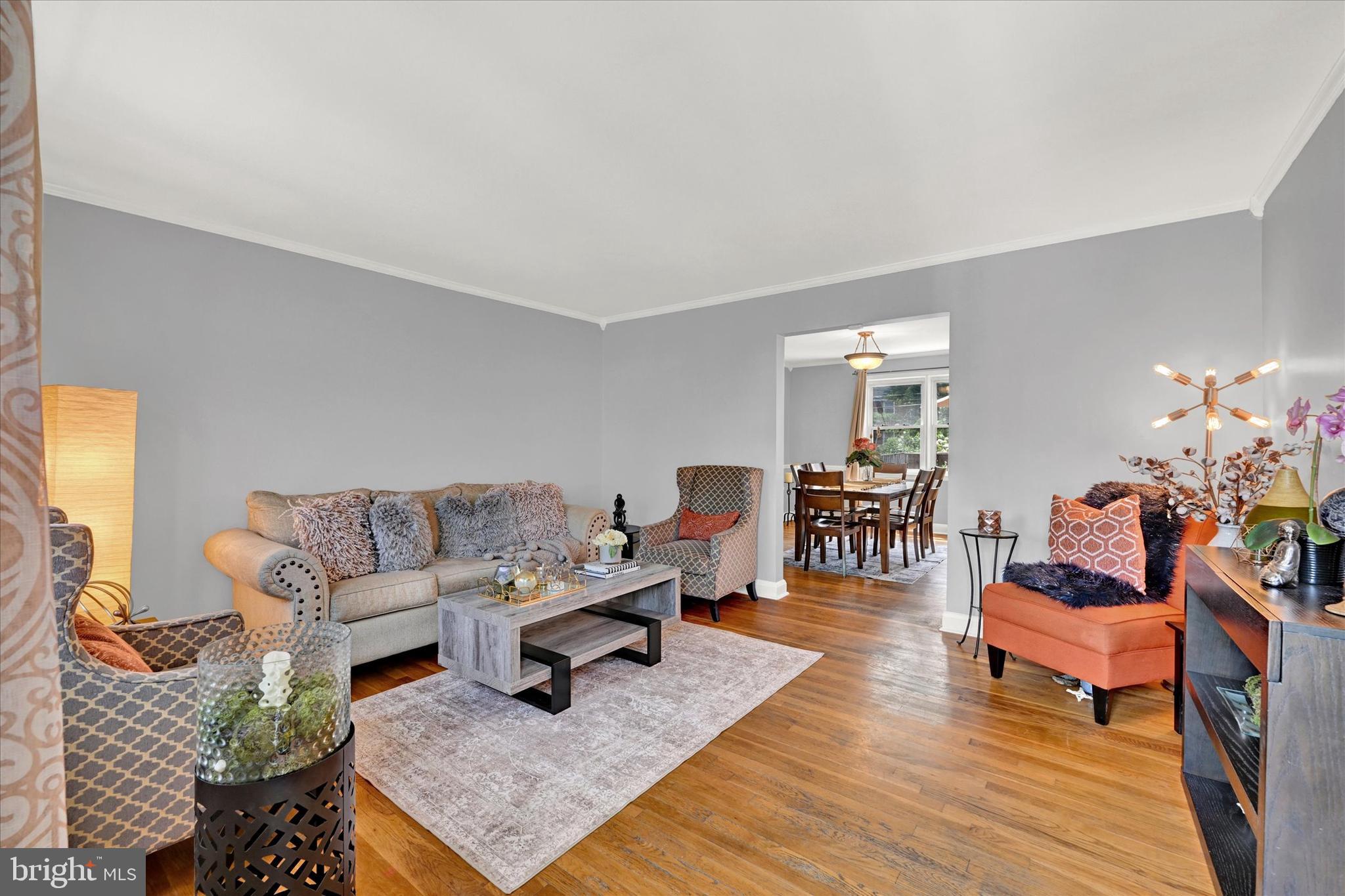 1203 Walker Avenue Baltimore, MD 21239 - Photo 4 of 31 a living room with furniture and wooden floor