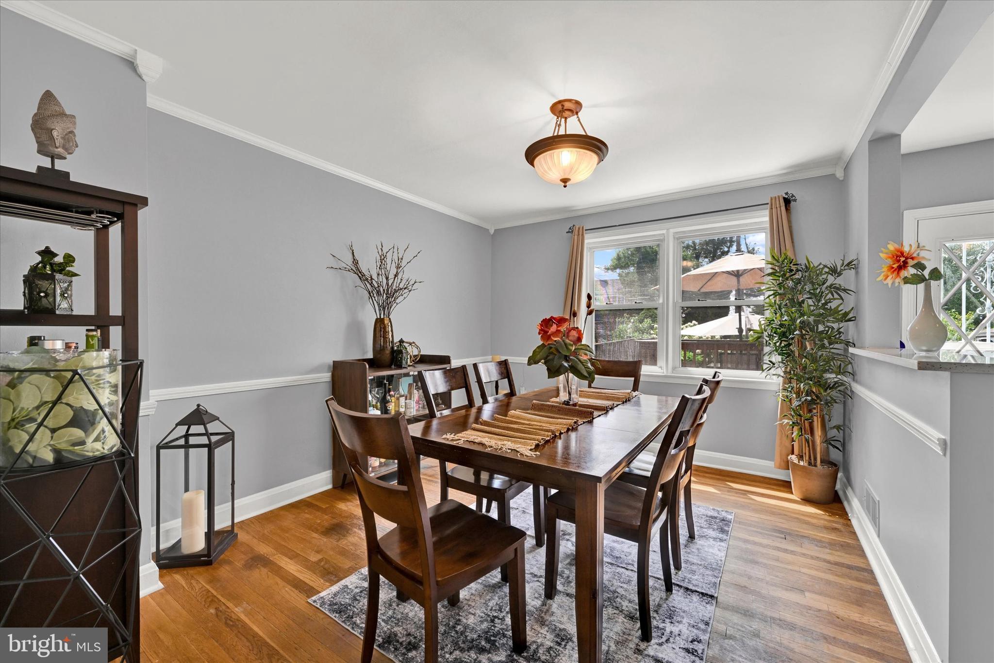 1203 Walker Avenue Baltimore, MD 21239 - Photo 6 of 31 a view of a dining room with furniture and wooden floor