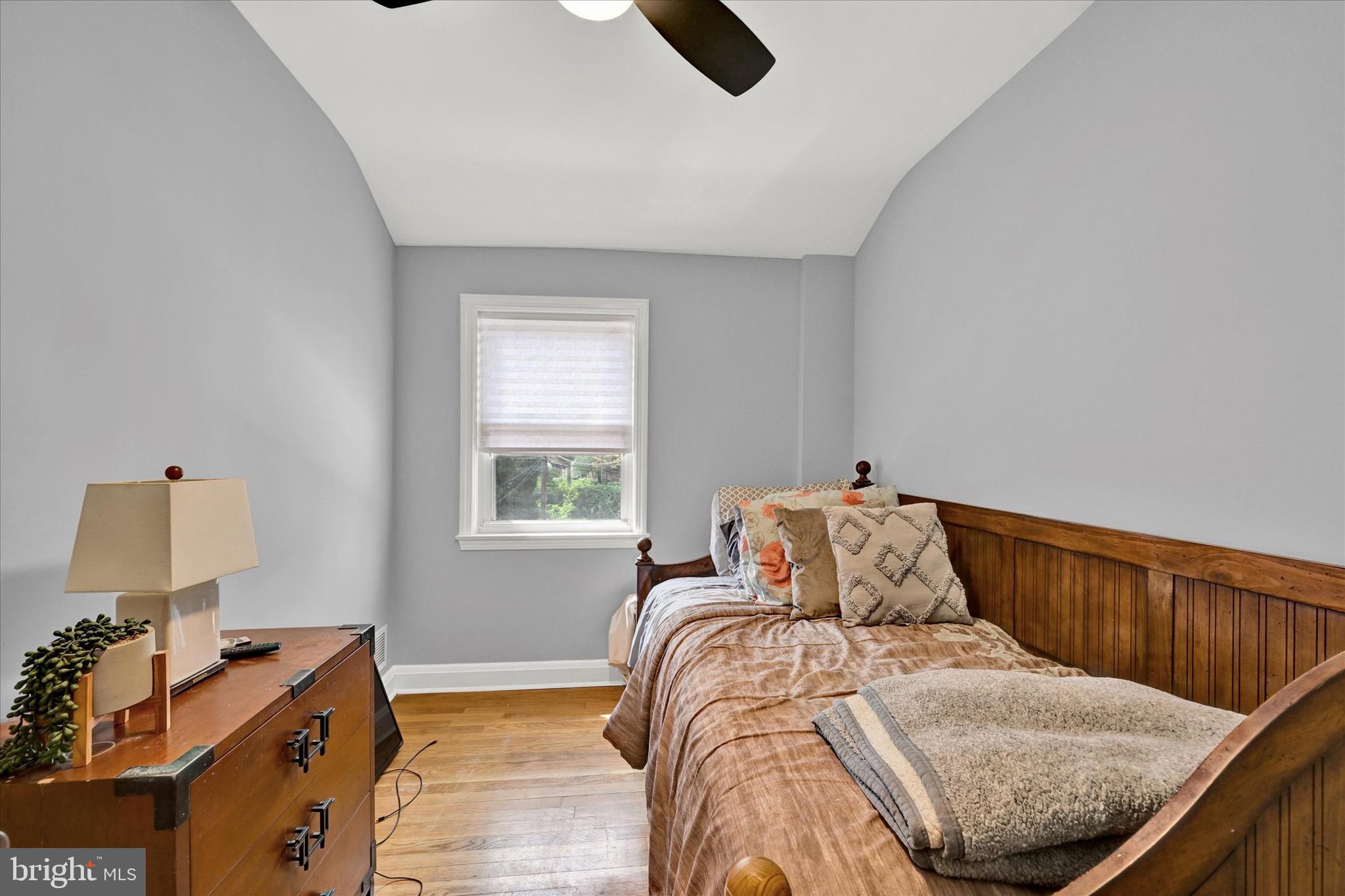 1203 Walker Avenue Baltimore, MD 21239 - Photo 10 of 31 a bedroom with a bed and window