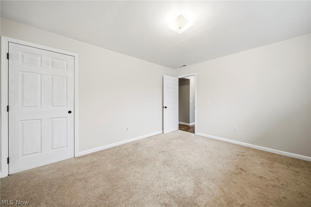 10397 Prouty Road Painesville, OH 44077 - Photo 21 of 32 Unfurnished bedroom with baseboards and carpet flooring