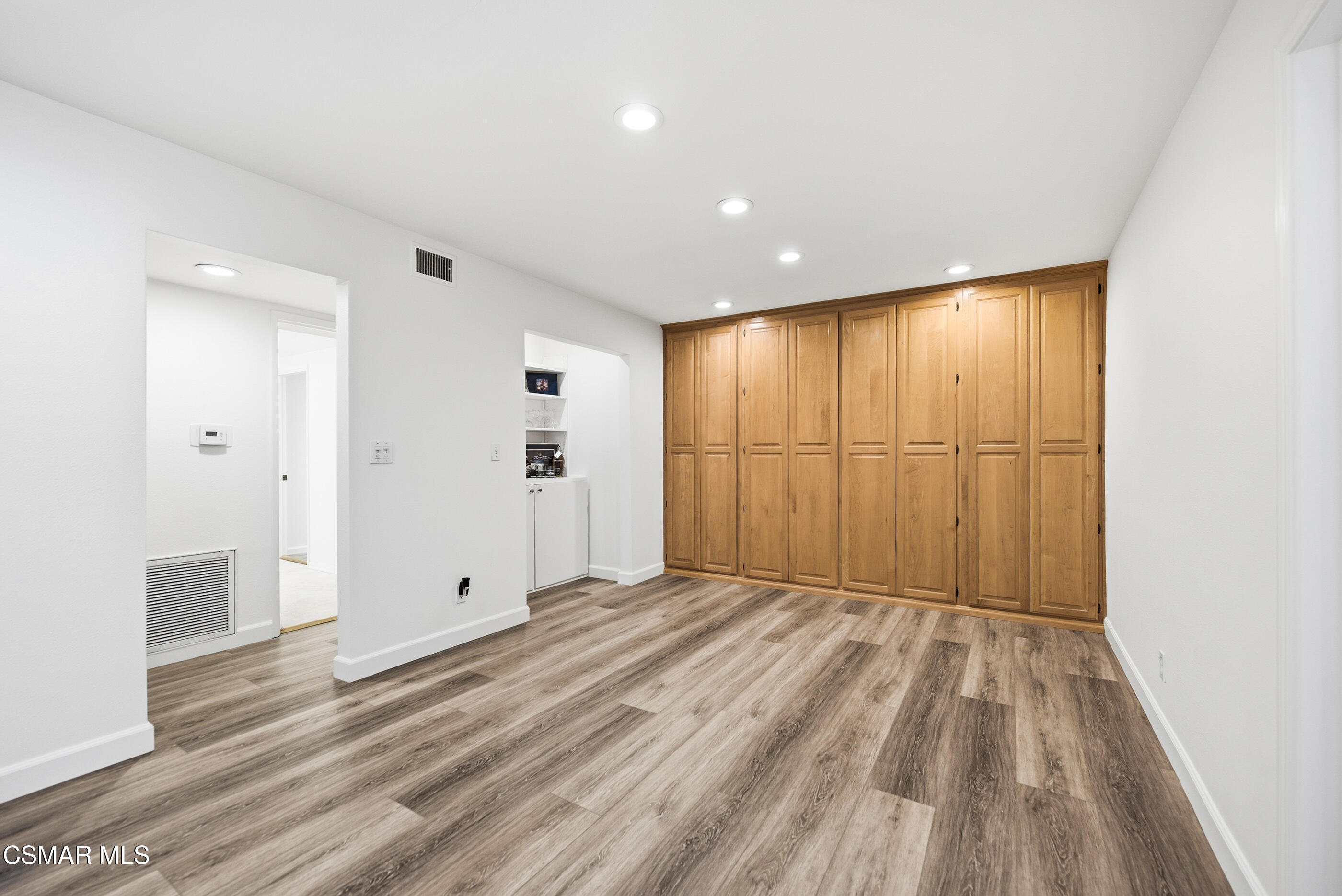 3598 Scofield Avenue Simi Valley, CA 93063 - Photo 29 of 86 a view of an empty room with wooden floor
