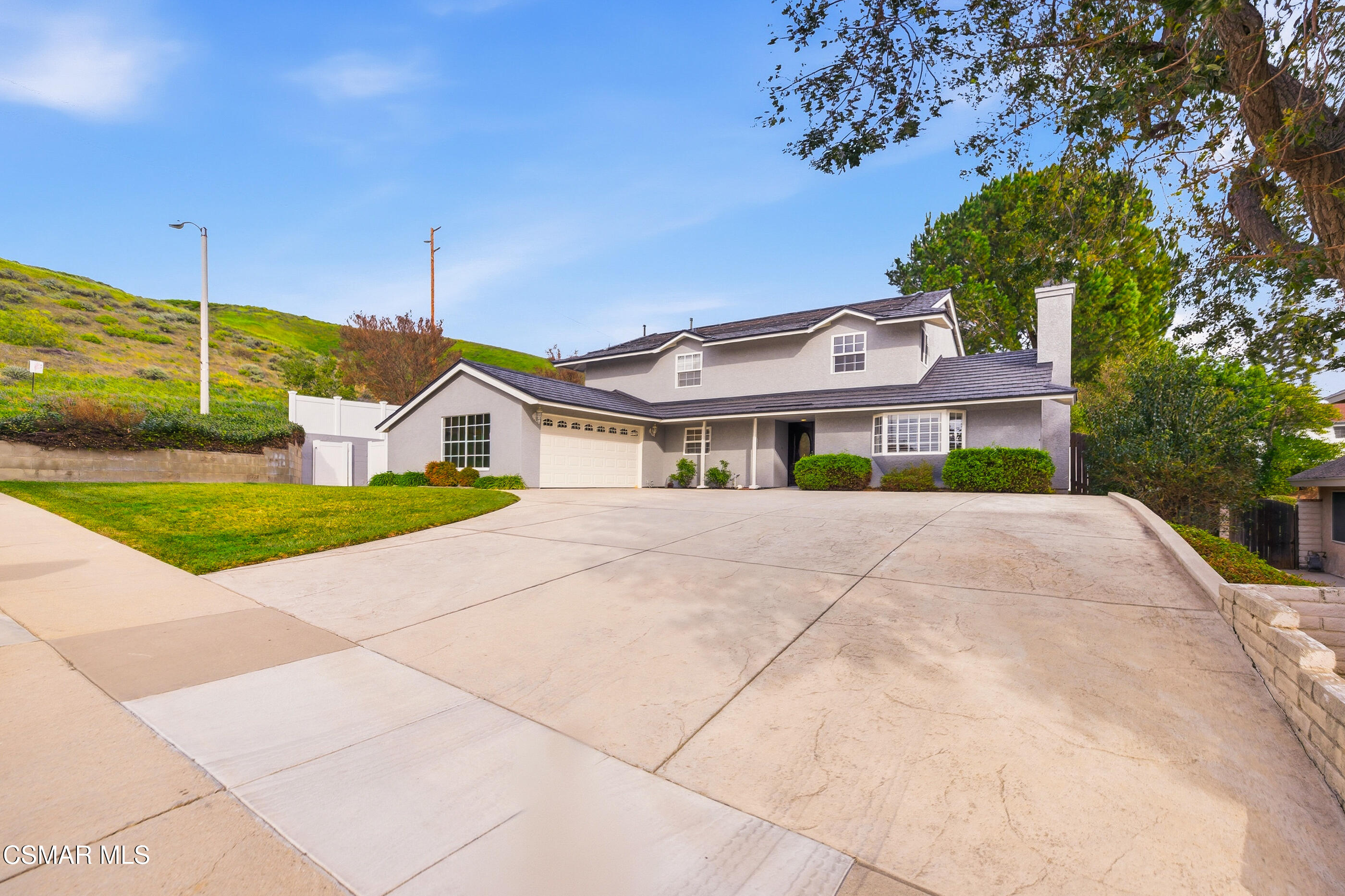 3598 Scofield Avenue Simi Valley, CA 93063 - Photo 3 of 86 a front view of a house with a yard