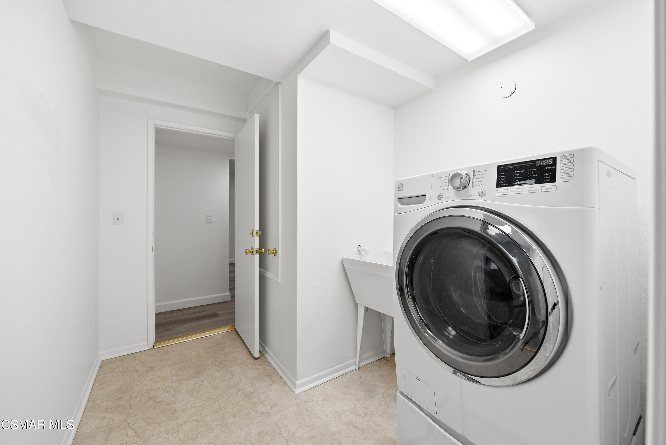 3598 Scofield Avenue Simi Valley, CA 93063 - Photo 38 of 86 a view of a hallway with washer and dryer